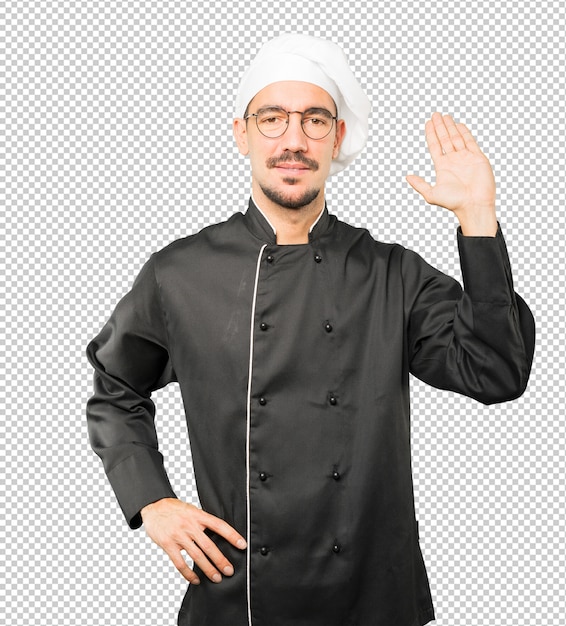 PSD young chef waving with his hand