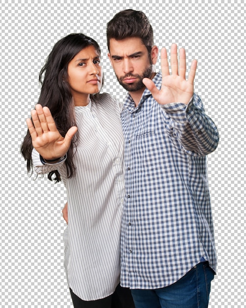young couple doing a stop gesture