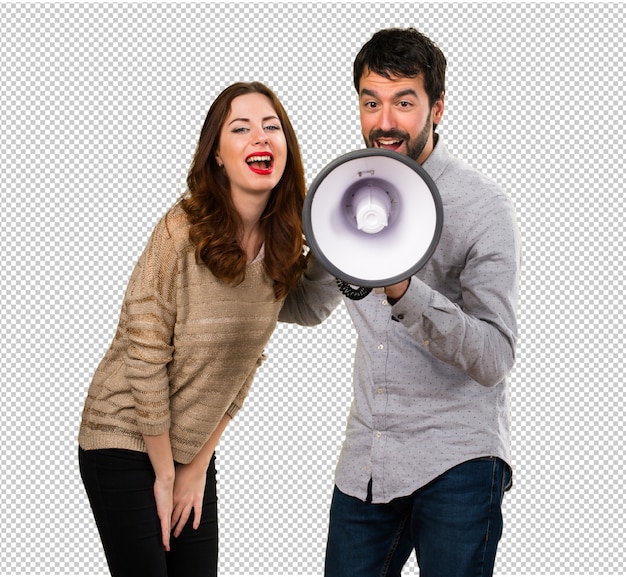 Young couple holding a megaphone