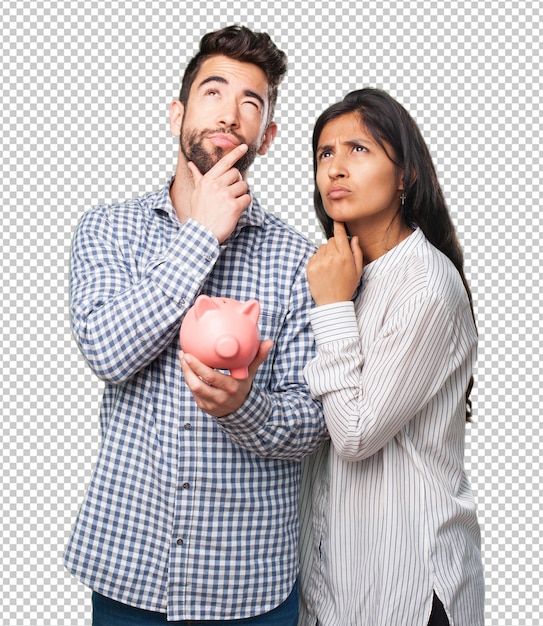 Young couple holding a piggy bank