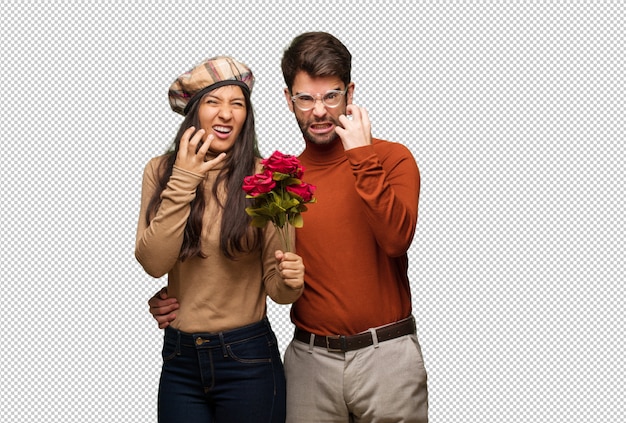 Young couple in valentines day angry and upset