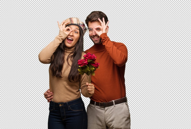 PSD young couple in valentines day confident doing ok gesture on eye