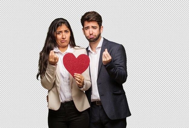 Young couple in valentines day doing a gesture of need