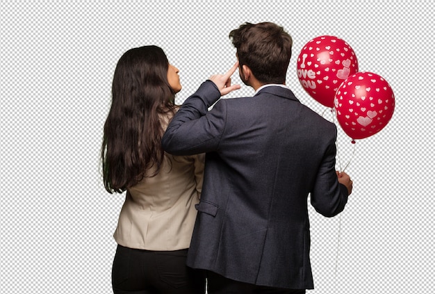 PSD young couple in valentines day from behind thinking about something