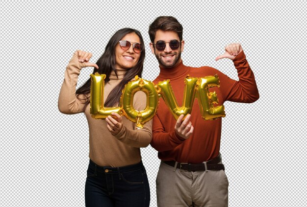 Young couple in valentines day pointing fingers, example to follow