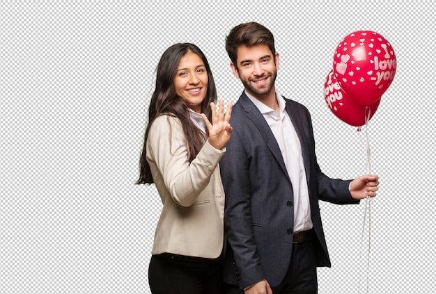 Young couple in valentines day showing number four