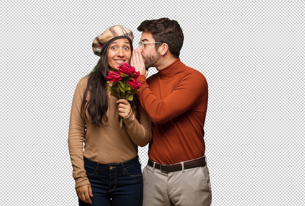 PSD young couple in valentines day whispering gossip undertone