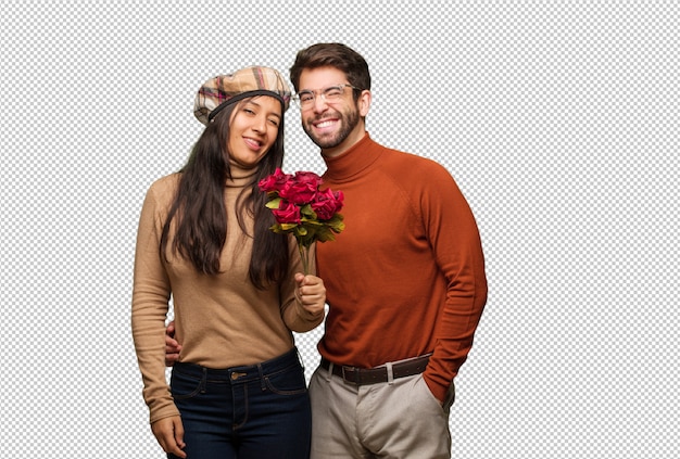 Young couple in valentines day winking, funny, friendly and carefree gesture