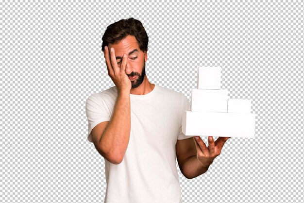 PSD young crazy bearded and expressive man holding blank packaging boxes