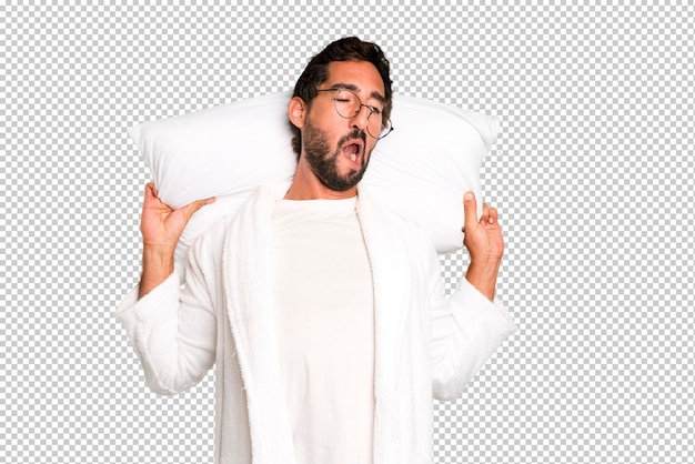 Young crazy bearded and expressive man wearing bathrobe and a pillow