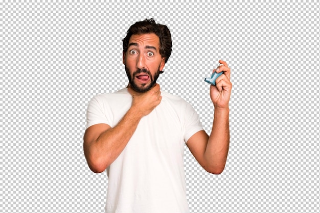 Young crazy bearded and expressive man with an asthma inhaler