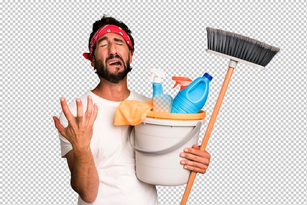 PSD young crazy bearded and expressive man with clean products housekeeper concept