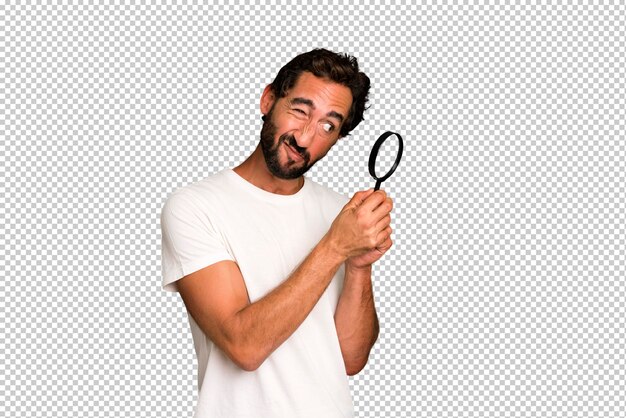 PSD young crazy bearded and expressive man with a magnifying glass search or find concept