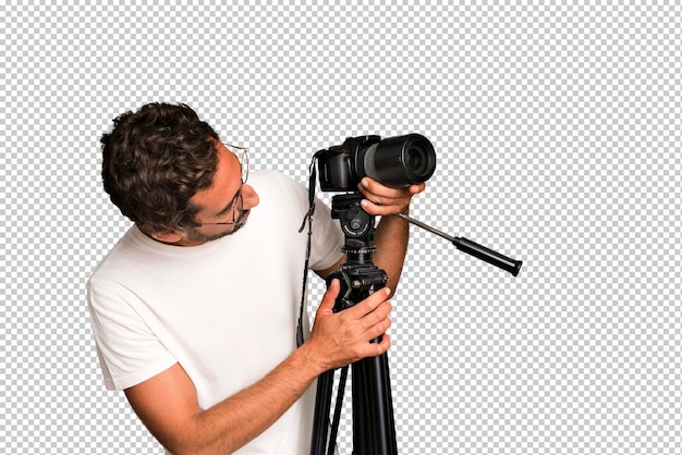 Young crazy bearded and expressive man with a photo camera photographer concept