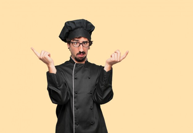 PSD young crazy man as a chef shouting with a crazy, amazed look of surprise