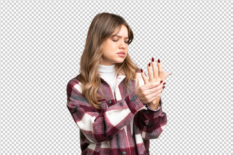 PSD young girl over isolated chroma key background suffering from pain in hands