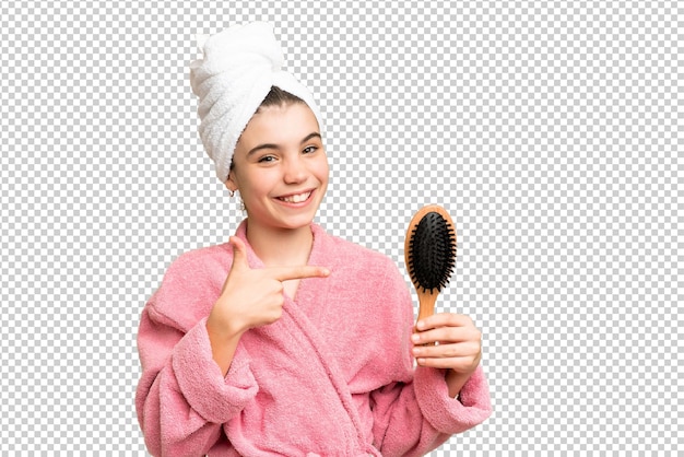 Young girl with hair comb and pointing it