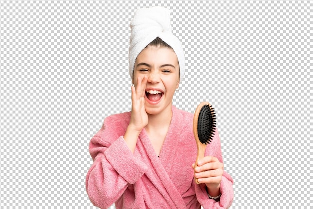 毛を<unk>んで口を大きく開けて叫ぶ若い女の子