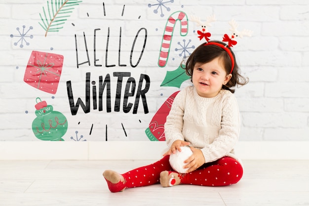 PSD young girl with hello winter mock-up