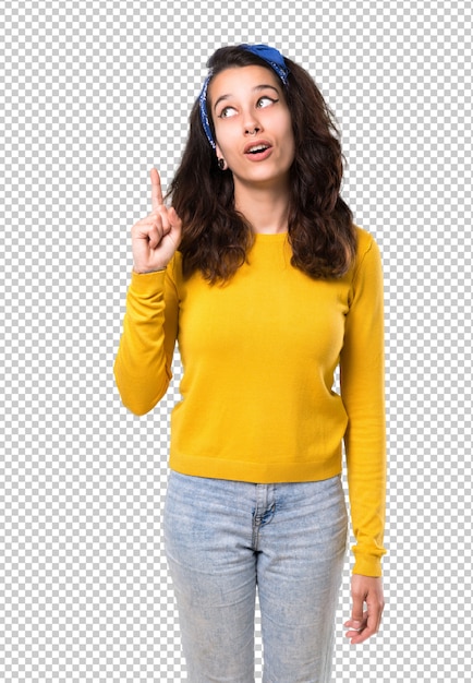 PSD young girl with yellow sweater and blue bandana on her head standing and thinking an idea