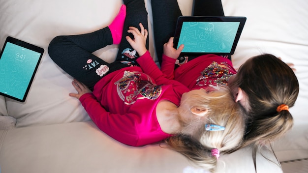 young girls using tablet