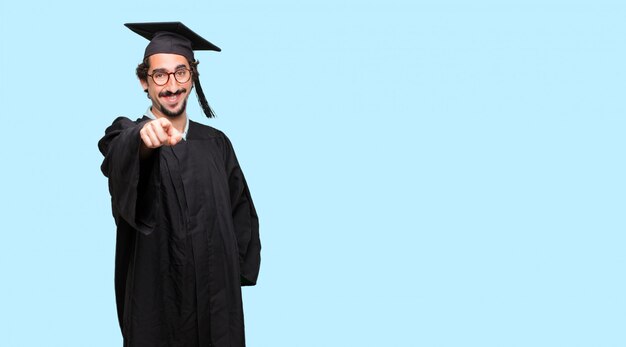 young graduated man Concentrating hard on an idea, with a serious far-off look
