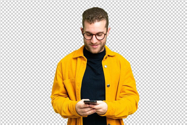 PSD young handsome blonde man over isolated chroma key background sending a message with the mobile