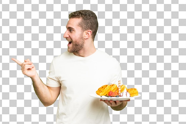Young handsome blonde man over isolated chroma key background