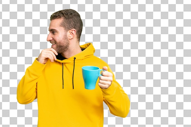 Young handsome blonde man over isolated chroma key background