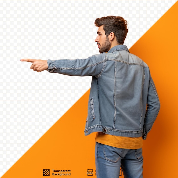 PSD young handsome man standing and pointing to object on copy space rear view against orange wall
