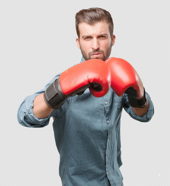 Giovane uomo bello con i guantoni da boxe