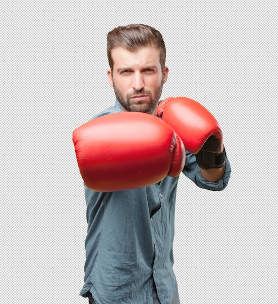 Giovane uomo bello con i guantoni da boxe