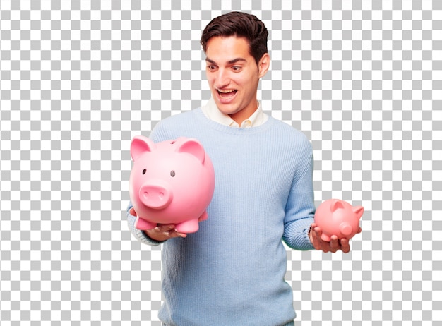 Young handsome tanned man with a piggy bank