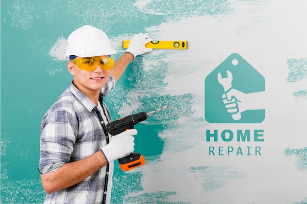 PSD young handyman holding a drill