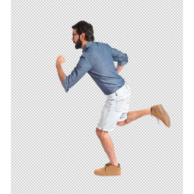 PSD young hipster man running fast over white background