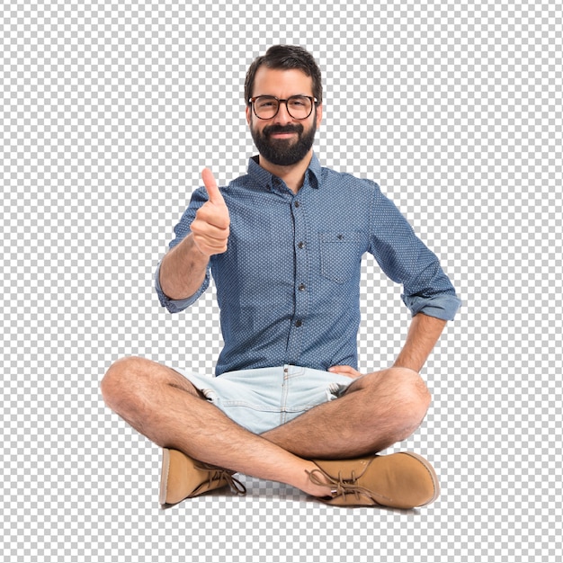 Young hipster man with thumb up