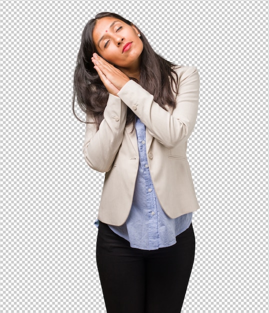 Young indian woman tired and very sleepy, looking comfortable and relaxed, sleep gesture