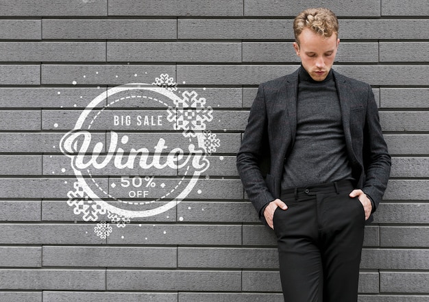 Young male promoting winter sales dicounts