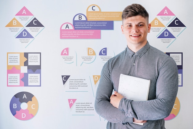 Young male at university holding book