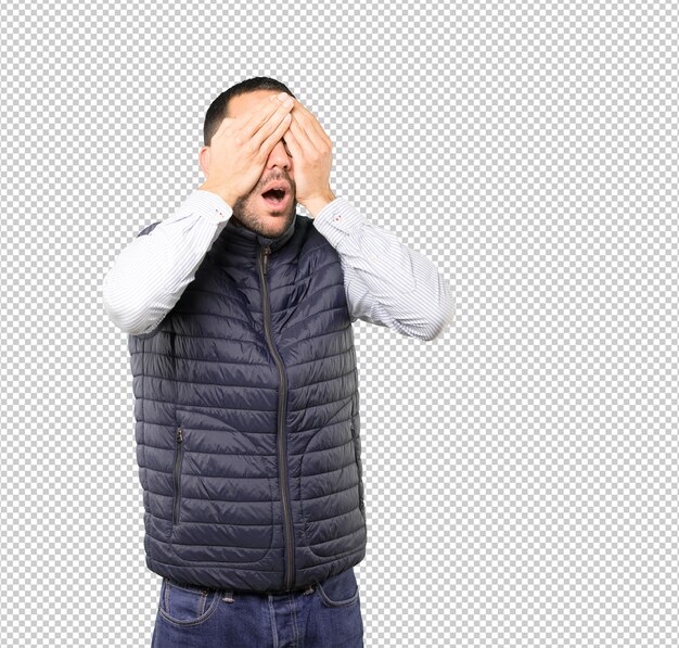 PSD young man covering his eyes with his hands