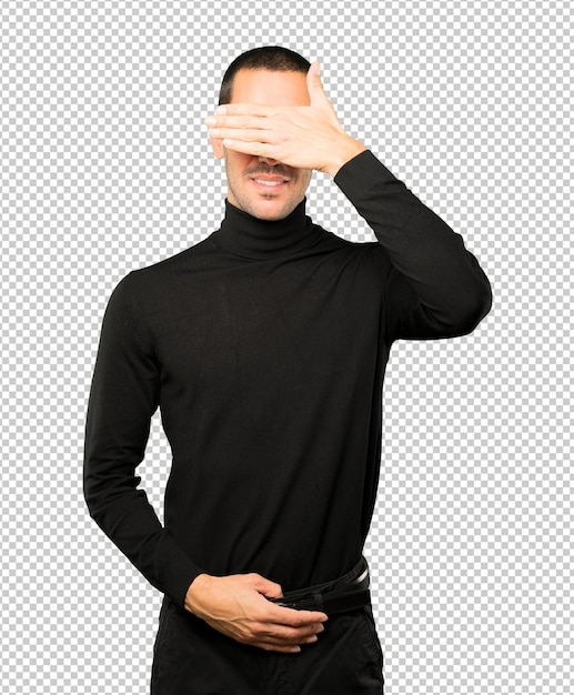 Young man covering his eyes with his hands