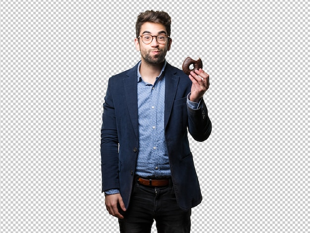 Young man eating a doughnut