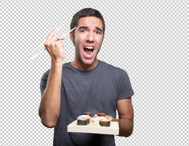 Young man eating sushi