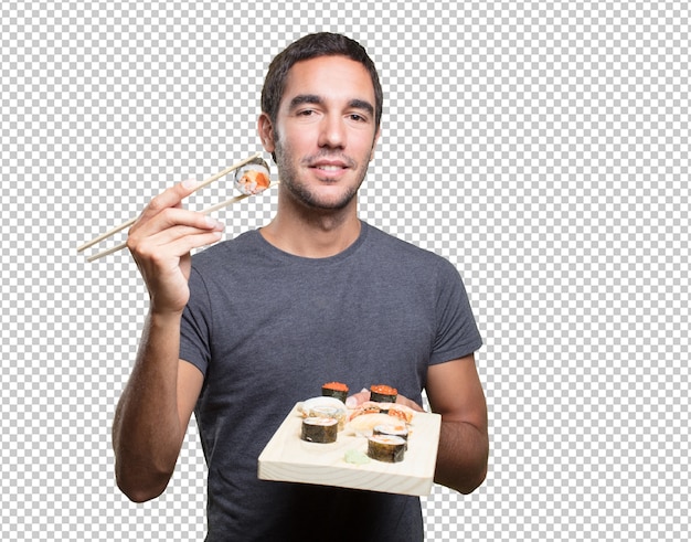 Young man eating sushi