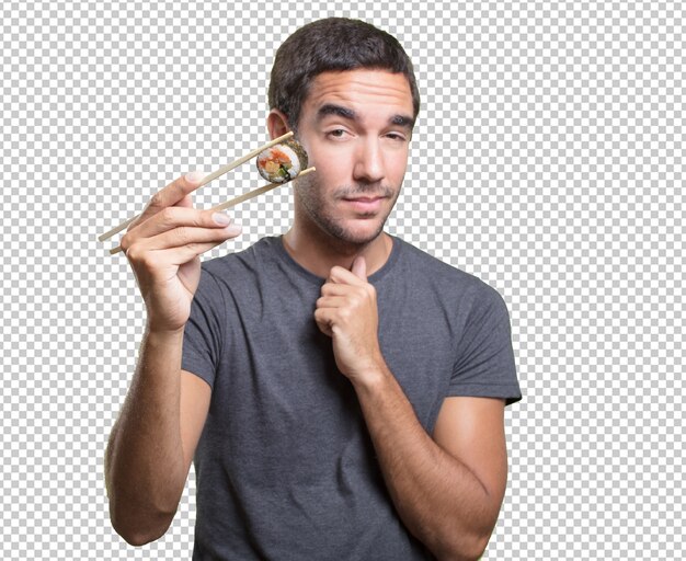 Young man eating sushi