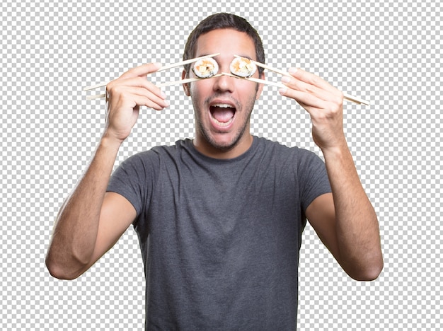 Young man eating sushi