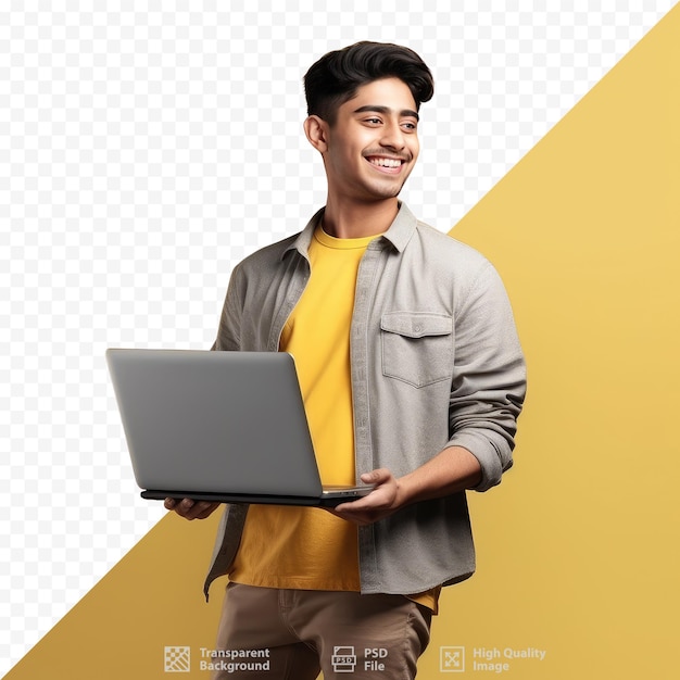 A young man is holding a laptop and smiling.