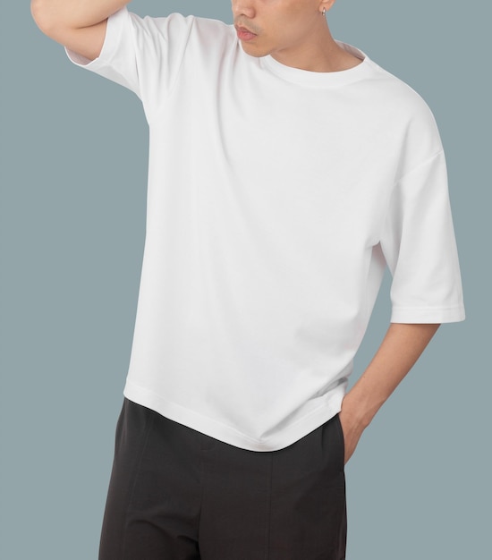 Young man in oversize t shirt mockup psd template for your design