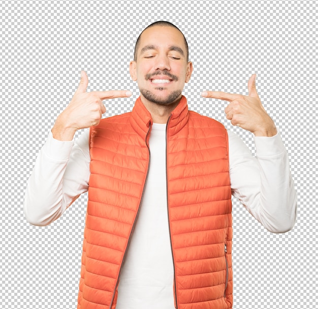 young man pointing to his teeth