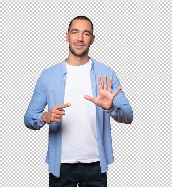 Young man pointing to his wrist